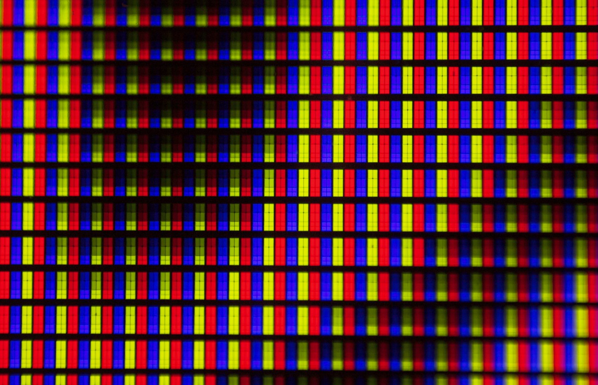 Macro close-up of red, green and blue LED pixels on a video wall